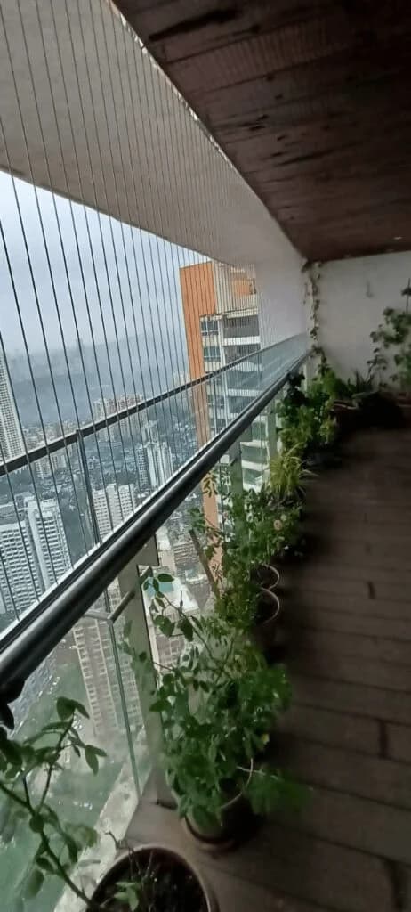 Plant-lined balcony corridor, fully secured