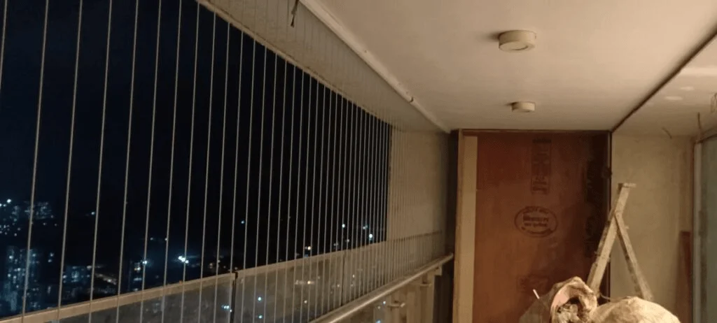 Installation in progress on a high-rise balcony