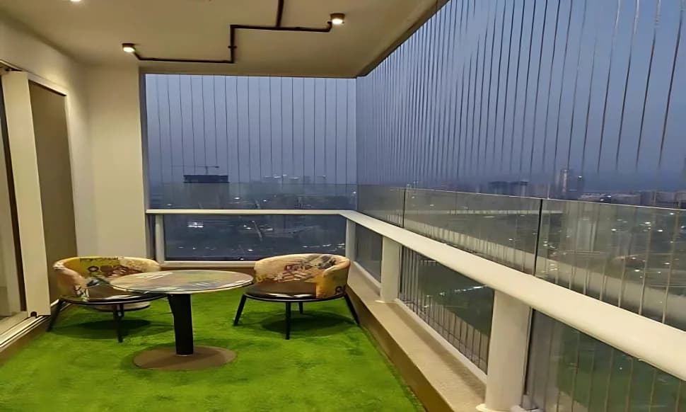 Evening balcony lounge with skyline backdrop